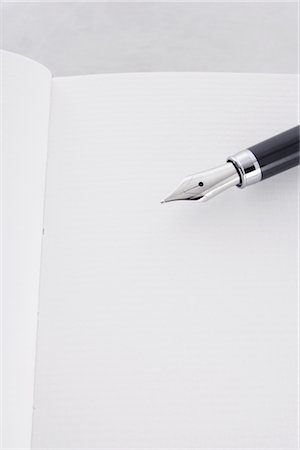 Close-up of Fountain Pen and Notebook Stock Photo - Rights-Managed, Code: 700-02371531