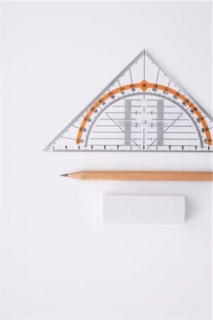 fourniture scolaire - Close-up of Pencil, Eraser and Protractor Foto de stock - Con derechos protegidos, Código: 700-02371547