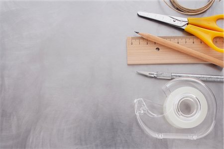 school supplies - Close-up of Tape, Ruler, Pencil, Scissors, Utility Knife, and String Stock Photo - Rights-Managed, Code: 700-02371551