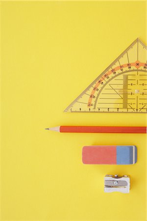 Close-up of Pencil Sharpener, Pencils, Eraser, and Protractor Foto de stock - Con derechos protegidos, Código: 700-02371598