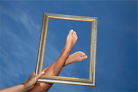 Woman Framing her Feet Stock Photo - Rights-Managed, Code: 700-02371605