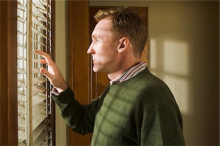 Man Looking out Window Foto de stock - Con derechos protegidos, Código: 700-02386089