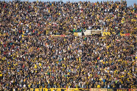 photo of a crowd of people at a game - Soccer Fans at Centenario Stadium, Montevideo, Uruguay Foto de stock - Con derechos protegidos, Código: 700-02418133