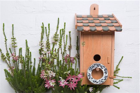 Ornate Birdhouse and Flowers Stock Photo - Rights-Managed, Code: 700-02428680