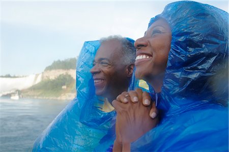 Couple Admiring the Falls Aboard the Maid of the Mist, Niagara Falls, Ontario, Canada Stock Photo - Rights-Managed, Code: 700-02461634