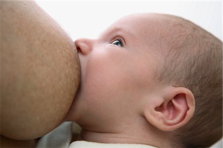 Close-up of Baby Breastfeeding Foto de stock - Con derechos protegidos, Código: 700-02586102