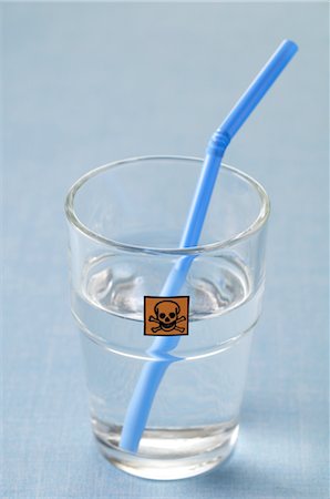 pollution concept - Close-up of Glass with Clear Liquid, Drinking Straw and Poison Label Stock Photo - Rights-Managed, Code: 700-02594041