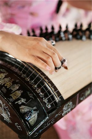 Playing the Slide Zither, Hoian, Vietnam Foto de stock - Direito Controlado, Número: 700-02593807