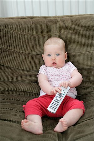 simsearch:614-05818912,k - Baby on Sofa with Remote Control Stock Photo - Rights-Managed, Code: 700-02637214