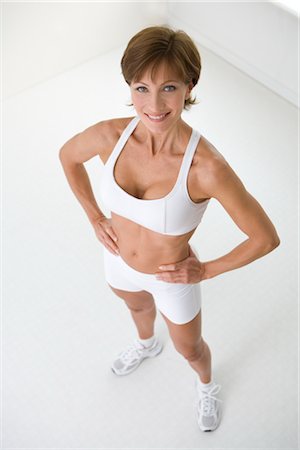 A Senior Woman with Sports Bra Outdoors on a Terrace in Summer, Exercising.  Stock Photo - Image of retired, exercise: 165544722