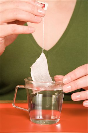 dunking food - Woman Steeping Green Tea Bag Stock Photo - Rights-Managed, Code: 700-02638195