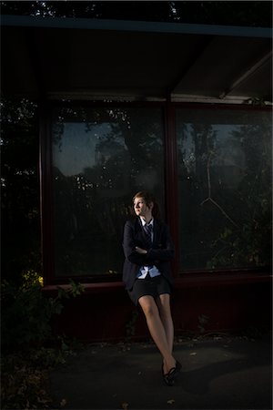 private school - Woman Waiting at Bus Stop at Night Foto de stock - Con derechos protegidos, Código: 700-02633614