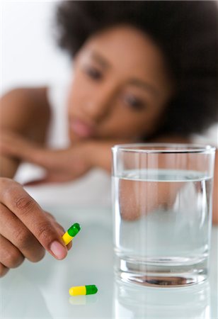 despair african american - Woman Taking Pills Stock Photo - Rights-Managed, Code: 700-02645564