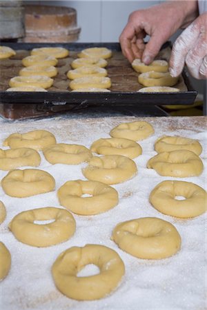 female pastry chef - Woman Placing Ring-Shaped Cakes on Baking Tray, Cerreto Laziale, Tivoli, Rome, Italy Stock Photo - Rights-Managed, Code: 700-02659606