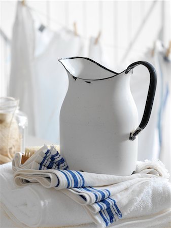 Metal Jug with Linens in Laundry Room Stock Photo - Rights-Managed, Code: 700-02669199