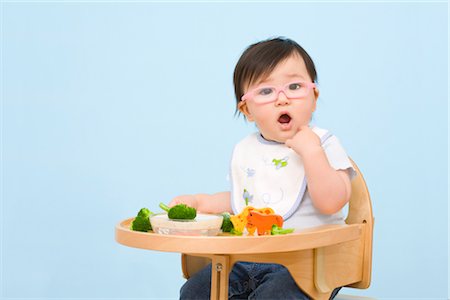 shocked eating - Baby Eating in Highchair Stock Photo - Rights-Managed, Code: 700-02669892