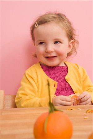 Girl Eating Orange Stock Photo - Rights-Managed, Code: 700-02670003