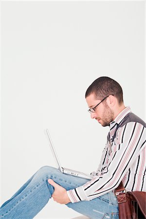 stressed student - Man Using Laptop Computer Foto de stock - Con derechos protegidos, Código: 700-02670652