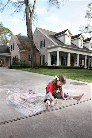 Girl Drawing on a Driveway Stock Photo - Rights-Managed, Code: 700-02670934