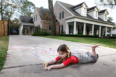 Girl Drawing on a Driveway Stock Photo - Rights-Managed, Code: 700-02670936