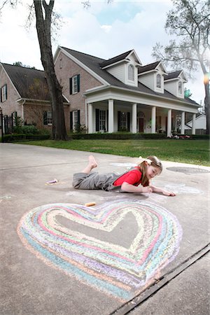 family home outside - Girl Drawing on a Driveway Stock Photo - Rights-Managed, Code: 700-02670939