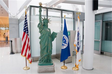 statue of liberty with american flag - Toronto Pearson Airport, Toronto, Ontario, Canada Stock Photo - Rights-Managed, Code: 700-02671511