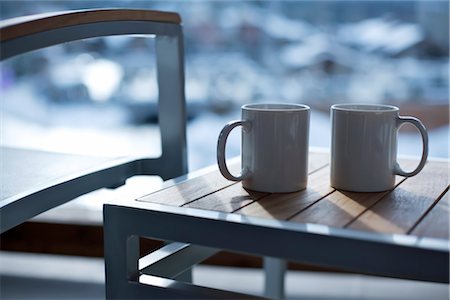 steaming coffee mug - Coffee Mugs on Deck, Whistler, British Columbia, Canada Stock Photo - Rights-Managed, Code: 700-02685986