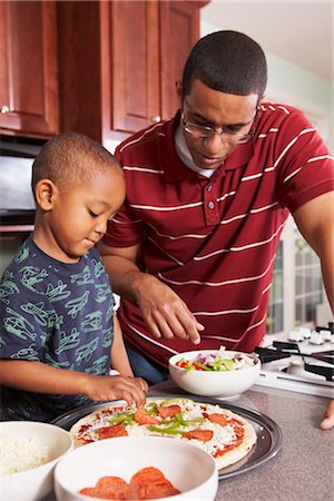 family cooking dinner - Father and Son in the Kitchen Making a Pizza Stock Photo - Rights-Managed, Code: 700-02686566