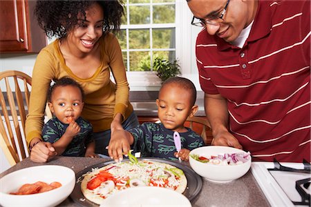 dinner young family - Family in the Kitchen Making a Pizza Stock Photo - Rights-Managed, Code: 700-02686567