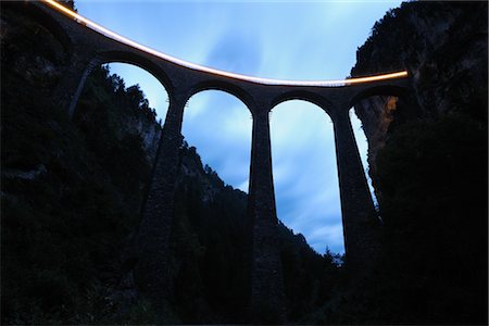 famous places switzerland - Looking Up at Viaduct at Dusk, on the Albula to Bernina Route, Alvaneu and Filisur Municipalites, Albula, Graubunden Canton, Switzerland Stock Photo - Rights-Managed, Code: 700-02691444