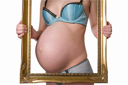 Pregnant Woman Holding Frame Stock Photo - Rights-Managed, Code: 700-02693498