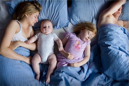 father baby bed - Family in Bed Stock Photo - Rights-Managed, Code: 700-02693507