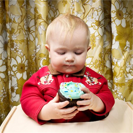 first baby - Baby with Cupcake Stock Photo - Rights-Managed, Code: 700-02693924