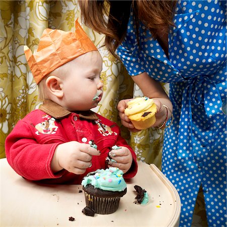 first - Mother Handing Baby Cupcake Stock Photo - Rights-Managed, Code: 700-02693926
