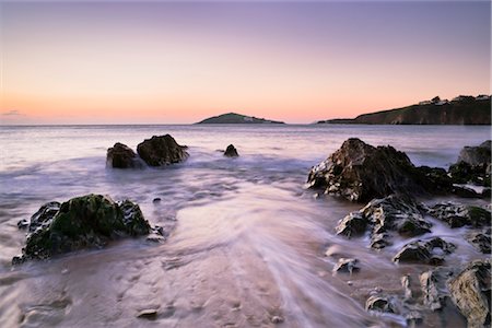 simsearch:700-02244789,k - Waves Breaking on Rocky Shoreline of Bantham Beach at Dusk, Burgh Island in the Distance, Bantham, Devon, England Stock Photo - Rights-Managed, Code: 700-02700642