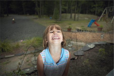 Smiling Little Girl in Backyard Stock Photo - Rights-Managed, Code: 700-02702546