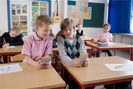 playing pupils inside the classroom - Students Playing Video Games in Class Stock Photo - Rights-Managed, Code: 700-02702608