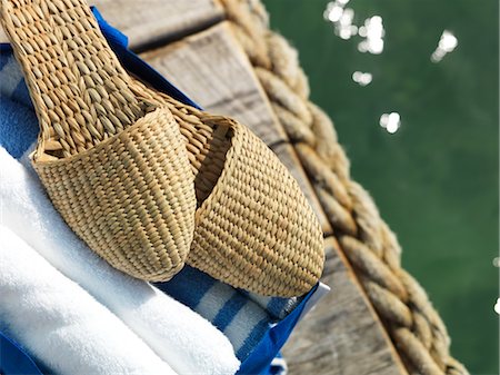 flip flops close - Towels and Shoes on a Dock by the Ocean, Belize Stock Photo - Rights-Managed, Code: 700-02702711