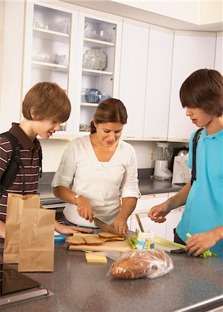 family lunch in home - Mother Making School Lunches for Sons Stock Photo - Rights-Managed, Code: 700-02738796