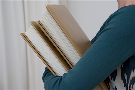 Woman Carrying Books Stock Photo - Rights-Managed, Code: 700-02756574