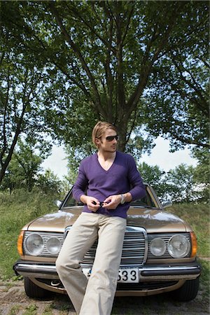 fashion photography car - Man Leaning on Hood of Car in Rural Setting Stock Photo - Rights-Managed, Code: 700-02757142