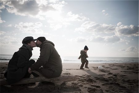 father and son play with a ball - Family on Beach in Winter, Lazio, Rome, Italy Stock Photo - Rights-Managed, Code: 700-02757165