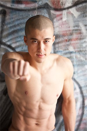 shaved head - Man Holding Fist in Front of Him, Las Vegas, Nevada, USA Stock Photo - Rights-Managed, Code: 700-02757436