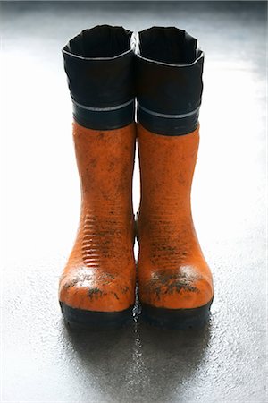 rubber boots in mud - Rubber Boots Foto de stock - Con derechos protegidos, Código: 700-02757469