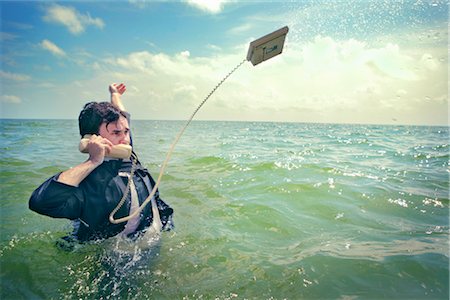failure - Businessman in the Ocean Talking on Telephone Stock Photo - Rights-Managed, Code: 700-02786874