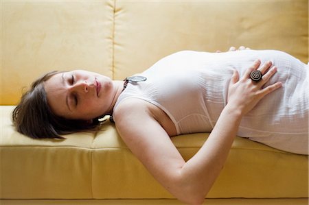 Pregnant Woman Lying on Sofa Stock Photo - Rights-Managed, Code: 700-02798138