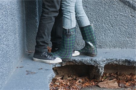 foot in sneakers - Couple's Legs Stock Photo - Rights-Managed, Code: 700-02791613