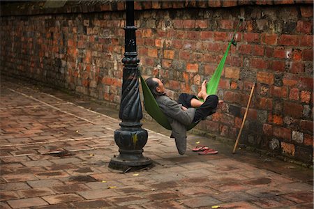 senior citizen sleeping - Man Sleeping in Hammock on Street, Hanoi, Vietnam Stock Photo - Rights-Managed, Code: 700-02828413