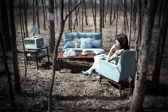 Woman Sitting in Vintage Living Room Furniture in a Forest Stock Photo - Premium Rights-Managed, Artist: Angus Fergusson, Image code: 700-02833227
