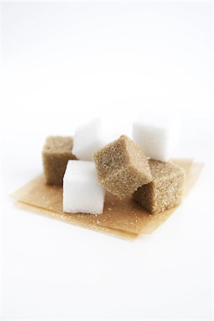 sugar cube on white - Brown and White Sugar Cubes on Brown Parchment Paper Stock Photo - Rights-Managed, Code: 700-02833238